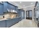 Modern kitchen with stainless steel appliances and granite countertops at 415 Muirfield Loop, Reunion, FL 34747