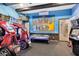 Game room with various arcade games and air hockey at 415 Muirfield Loop, Reunion, FL 34747