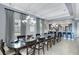 Spacious dining room with large table and access to the kitchen at 415 Muirfield Loop, Reunion, FL 34747