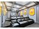 Home theater with tiered seating and large screen at 415 Muirfield Loop, Reunion, FL 34747