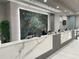 Modern reception area with a large marble countertop and friendly staff at 12544 Floridays Resort Dr # 203-B, Orlando, FL 32821