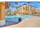 Relaxing pool area with lounge chairs at 12544 Floridays Resort Dr # 203-B, Orlando, FL 32821