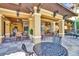 Outdoor patio area with tables and chairs, perfect for relaxing at 12544 Floridays Resort Dr # 203-B, Orlando, FL 32821