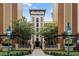 Exterior view of a residential building with a walkway and landscaping at 12544 Floridays Resort Dr # 203-B, Orlando, FL 32821