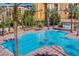 Resort-style pool with multiple lounge chairs at 12544 Floridays Resort Dr # 203-B, Orlando, FL 32821