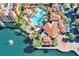 Aerial view of resort with pool and lake at 12544 Floridays Resort Dr # 203-B, Orlando, FL 32821