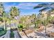 Pool deck with lounge chairs and palm trees at 12544 Floridays Resort Dr # 203-B, Orlando, FL 32821