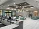 Spacious lobby with comfortable seating and a modern chandelier at 12544 Floridays Resort Dr # 203-B, Orlando, FL 32821