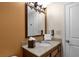 Bathroom with granite countertop, sink, and large mirror at 12544 Floridays Resort Dr # 203-B, Orlando, FL 32821