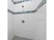 Modern shower with wave-patterned wall tiles at 17279 Peggy Ave, Mount Dora, FL 32757