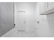 Laundry room with tile floor and white cabinets at 17279 Peggy Ave, Mount Dora, FL 32757