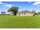 Large backyard showcasing a home and greenery at 17279 Peggy Ave, Mount Dora, FL 32757