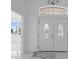 Bright entryway with double doors and marble floors at 17279 Peggy Ave, Mount Dora, FL 32757