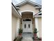 House entrance with double doors and landscaping at 17279 Peggy Ave, Mount Dora, FL 32757