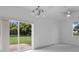Bright dining room with sliding glass doors leading to backyard at 17279 Peggy Ave, Mount Dora, FL 32757