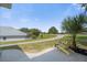 Landscaped backyard with a path and a relaxing chair at 21242 Braveheart Dr, Leesburg, FL 34748