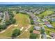 Aerial view of homes and golf course at 21242 Braveheart Dr, Leesburg, FL 34748
