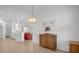 Bright dining room with wood furniture and a chandelier at 21242 Braveheart Dr, Leesburg, FL 34748