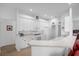 Modern kitchen with white cabinets and a large island at 21242 Braveheart Dr, Leesburg, FL 34748