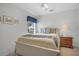 Guest bedroom with full-size bed and nightstand at 21242 Braveheart Dr, Leesburg, FL 34748