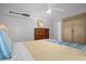 Main bedroom with king-size bed and built-in wardrobe at 21242 Braveheart Dr, Leesburg, FL 34748