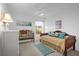 Cozy bedroom with daybed and ample natural light at 21242 Braveheart Dr, Leesburg, FL 34748