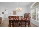 Spacious dining area with a large table and access to kitchen at 21242 Braveheart Dr, Leesburg, FL 34748