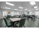 Bright meeting room with tables and chairs at 21242 Braveheart Dr, Leesburg, FL 34748