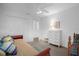 Bright bedroom with double bed, dresser, and ample closet space at 21242 Braveheart Dr, Leesburg, FL 34748