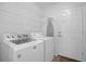 Laundry room with washer, dryer, and ample shelving at 21242 Braveheart Dr, Leesburg, FL 34748