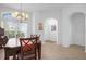 Bright dining room features a chandelier and large windows at 21242 Braveheart Dr, Leesburg, FL 34748
