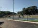 Community tennis court with chain link fence at 525 Conway Rd # 201, Orlando, FL 32807
