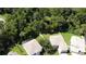 Aerial view showcasing multiple houses nestled in a lush, green wooded area at 276 Tavestock Loop, Winter Springs, FL 32708
