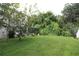 Lush green backyard offering privacy and tranquility at 276 Tavestock Loop, Winter Springs, FL 32708