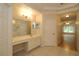 Bathroom with vanity and access to hallway at 276 Tavestock Loop, Winter Springs, FL 32708