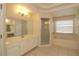 Bathroom with shower, tub, and double vanity at 276 Tavestock Loop, Winter Springs, FL 32708