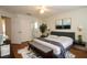Bedroom with attached bathroom and wood floors at 276 Tavestock Loop, Winter Springs, FL 32708