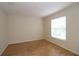 Empty bedroom with hardwood floors and a window at 276 Tavestock Loop, Winter Springs, FL 32708