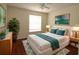 Bedroom with wood floors and stylish decor at 276 Tavestock Loop, Winter Springs, FL 32708