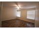 Bright bedroom featuring hardwood floors and window blinds at 276 Tavestock Loop, Winter Springs, FL 32708