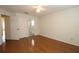 Bedroom with hardwood floors and access to bathroom at 276 Tavestock Loop, Winter Springs, FL 32708