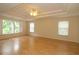 Bright and airy bedroom featuring hardwood floors and natural light at 276 Tavestock Loop, Winter Springs, FL 32708