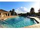 Inviting community pool with lounge chairs and a fun water feature for  at 276 Tavestock Loop, Winter Springs, FL 32708