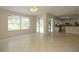 Open living space with tiled floors and a view into the kitchen at 276 Tavestock Loop, Winter Springs, FL 32708