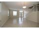 Spacious living room with tiled floors and an open layout at 276 Tavestock Loop, Winter Springs, FL 32708