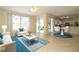Living room with access to a lanai and views of the backyard at 276 Tavestock Loop, Winter Springs, FL 32708