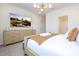 Bright main bedroom with large TV and dresser at 5887 High Seas Dr, Orlando, FL 32821