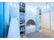 bedroom with a built in bunk bed and storage at 5887 High Seas Dr, Orlando, FL 32821