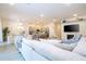 Open floorplan connecting kitchen, living room, and dining areas at 5887 High Seas Dr, Orlando, FL 32821