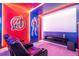 Home theater with screen, reclining seats, and themed decor at 5887 High Seas Dr, Orlando, FL 32821